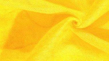 Parlak sarı madde. Bu ipek son derece pürüzsüz ve yumuşak, güzel pürüzsüz bir dokusu var. arkaplan deseni