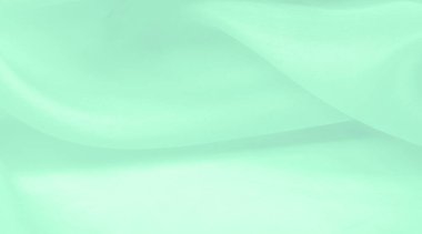 Bulanık yeşil ipek kumaş. Yumuşak ipek dokuma ile sıcak yeşil bir renk gösteren saten dokuma bu maddenin yüzeyine muhteşem bir parıltı ekler..