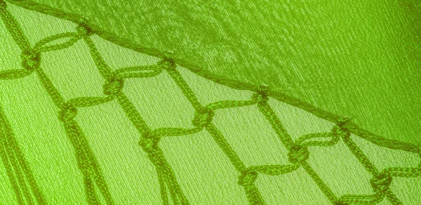 stock image Green silk shawl with fringe at the edge of the fabric. This is a common type of tie. Warm green on a white background. Template