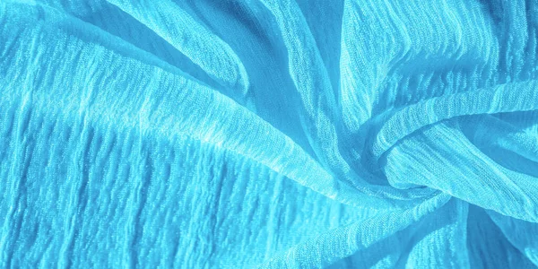 丝绸面料 蓝色皱纹布的纹理 蓝色褶皱 波浪形表面纹理 特写镜头 软焦点 — 图库照片