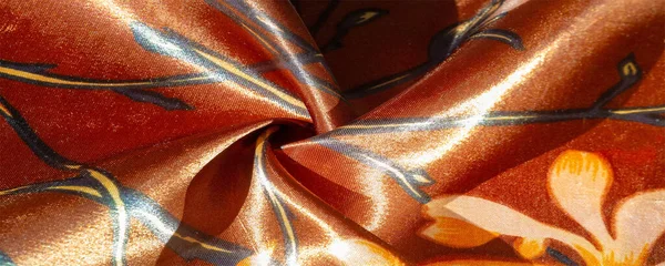 stock image brown silk fabric with floral print, photo taken in bright light, texture background, pattern