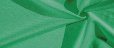 Yeşil ipekli kumaş. Yeşil saten kumaş arka plan. Zümrüt arkaplan üstü görünümü