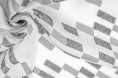 Siyah geometrik eşkenar dörtgen şekilli beyaz ipek kumaş. Karanlık. Geçmişi. Şablon.