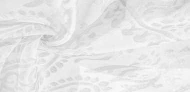 İpek kumaş, kar beyazı kumaş. Beyaz arka planda zarif çiçeklerin gölgeleri, Paisley 'nin fotoğrafı. Doku, desen, koleksiyon