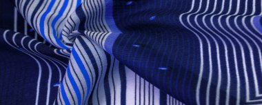 İpek kumaş, mavi arka plan, çizgili beyaz ve mor çizgiler, Meksika teması, Meksika pançosu kostümleri. Desen deseni, koleksiyon,