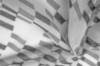 Siyah geometrik eşkenar dörtgen şekilli beyaz ipek kumaş. Karanlık. Geçmişi. Şablon.