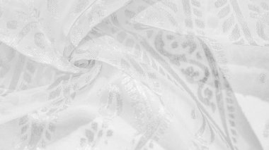 İpek kumaş, kar beyazı kumaş. Beyaz arka planda zarif çiçeklerin gölgeleri, Paisley 'nin fotoğrafı. Doku, desen, koleksiyon
