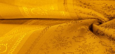 Sarı kumaş. Kehribar turuncu. Soyut doku. Kumaş liflerinden yapılmış renkli yüzey. Doku, arkaplan, desen