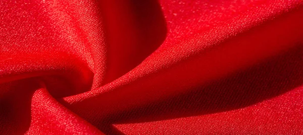 Red silk. As an abstract background, you can use the texture of luxurious red silk or satin. colorful texture, background, pattern