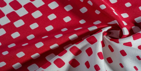 stock image Silk fabric with a pattern of red squares on a white background. texture background pattern.