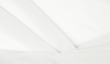 Kusursuz arkaplan dokusu - beyaz ipek. Bu antika beyaz ipek kumaşla klasik bir estetik elde et. Elinde pürüzsüz ve çıtır çıtır, zengin fildişi rengi göz kamaştırıcı bir parıltı yaratır..