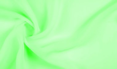 Doku - soluk yeşil ipek. Bu kumaşı herhangi bir mevsim için sıradan bir görünüme dönüştürebilirsin. Yumuşak siluetlere kolayca akabilen esnek, akışkan kumaşlar her şeyi yaratmanızı sağlar..