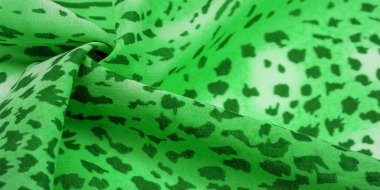 Yeşil-beyaz çizgili ipek kumaş, Afrika tarzı zebra derisi. Tasarımcı için, tasarımın taslağı, dekoratörün çevresi. Arkaplan dokusu koleksiyonu