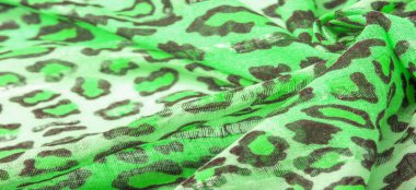 İpek kumaş yeşil, leopar desenli. Hafif leopar desenli ipek senin tasarımın için mükemmel, şık görünüyor ve kaba değil! Doku, arkaplan, desen
