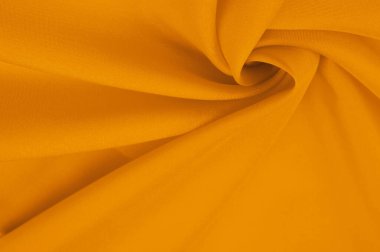 Güzel sarı ipek kumaş dekorasyon için mükemmeldir. Dokunmak için yumuşak ve lüks. Koyu kehribar rengi her yere sıcaklık ve zarafet ekler..