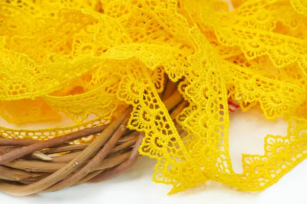 Add pops of color to any outfit with a yellow lace ribbon. Give new life to old clothes with this trendy finish. Easy to sew on or stick to clothes and accessories.