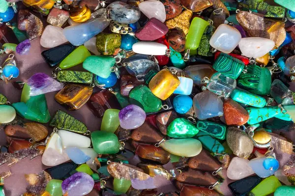Seamless texture of semi-precious stones. saying Beads pendants jewelry. Semi-precious stones are hard gemstones created organically. including lava or ocean hotspots, mines and shells.