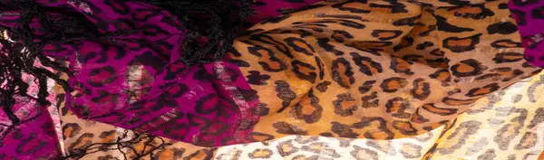 silk brown red fabric with leopard print. Light silk with a leopard print will perfectly fit into your design, it looks stylish and not vulgar! Texture, background, pattern