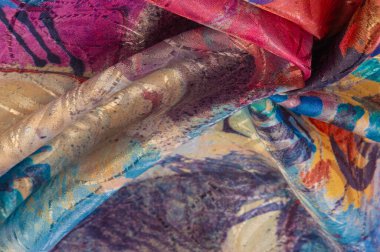 Boyalı bir palette ipek kumaş, soyut çizim, parlak renkler, kırmızı-sarı-mavi renk, sınırsız hayal gücü. doku, arkaplan, desen,