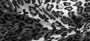 İpek kumaştan siyah beyaz leopar desenli. Leopar desenli hafif ipek senin tasarımına mükemmel uyacak, şık görünüyor ve kaba değil! Doku, arkaplan, desen