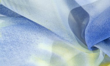 Yumuşak mavi, soyut desenleri ve yatak tonları olan ipek kumaş, sarı ve beyaz tonlarda. Doku, desen, koleksiyon