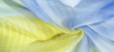 Yumuşak mavi, soyut desenleri ve yatak tonları olan ipek kumaş, sarı ve beyaz tonlarda. Doku, desen, koleksiyon