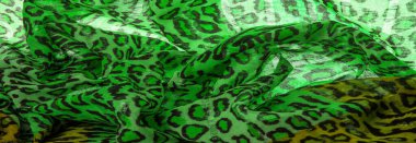 Doku, arkaplan, desen, ipek kumaş yeşil, leopar desenli. Hafif leopar desenli ipek tasarımınız için mükemmel, şık görünüyor ve kaba değil.!