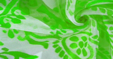 İpek kumaş, yeşil kumaş. Beyaz arka planda zarif çiçeklerin gölgeleri, Paisley 'nin fotoğrafı. Doku, desen, koleksiyon
