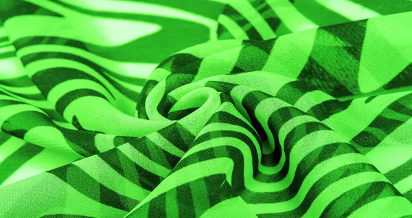 silk fabric, green and white abstract lines. The magical form of abstract white and green pattern. Retro modern decor, textile art, design, texture, background, pattern