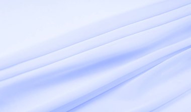 Kusursuz arkaplan dokusu - soluk mavi ipek. Bu basit ama sofistike kumaşın nüanslarının kendi adına konuşmasına izin ver. Yumuşak, kumlu doku, hafif parlak mavi renk.