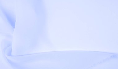 Kusursuz arkaplan dokusu - soluk mavi ipek. Bu basit ama sofistike kumaşın nüanslarının kendi adına konuşmasına izin ver. Yumuşak, kumlu doku, hafif parlak mavi renk.