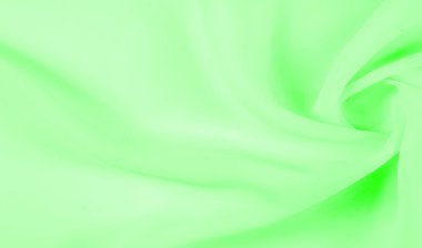 Doku - soluk yeşil ipek. Bu kumaşı herhangi bir mevsim için sıradan bir görünüme dönüştürebilirsin. Yumuşak siluetlere kolayca akabilen esnek, akışkan kumaşlar her şeyi yaratmanızı sağlar..