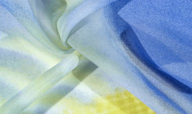 Yumuşak mavi, soyut desenleri ve yatak tonları olan ipek kumaş, sarı ve beyaz tonlarda. Doku, desen, koleksiyon