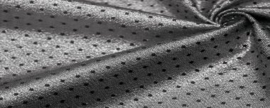 Küçük puantiyeli metalik parıltılı kumaş. Siyah. Bazen bir kumaş eklemeniz gerekir, bizim ipeklerimiz gibi..