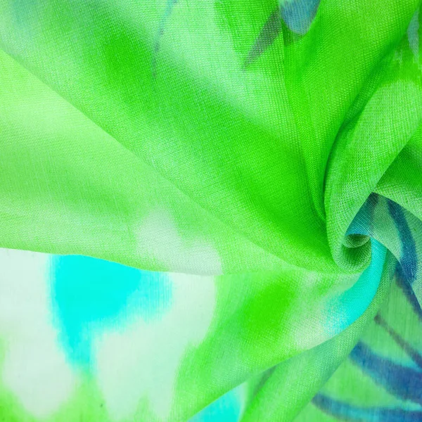 silk fabric, green-blue-yellow and white flowers, high-grade dusty green tulle. Texture pattern, collection