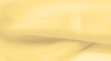 Bulanık sarı ipek kumaş. Kremsi bej rengini ve ışıldayan saten kaplamasını gösteriyor. Hala şifonun ve akıcı kumaşın tipik tazeliğini koruyor..