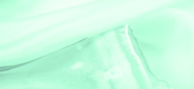 Bulanık yeşil ipek kumaş. Bu ipek ipte parlak bir cazibe çiçek açıyor. Kelly Green rengi çekici ve neşeli, ve hafif parlak yüzeyi enerjisi ve şık tonu ile uyumlu..