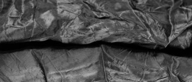 Kaliteli siyah ipek kumaş istisnai bir kumaştır, kendi başına güzeldir ya da mükemmel seçiminizi vurgulamak için bir aksesuar olarak..