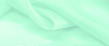 Bulanık yeşil ipek kumaş. Bu ipek ipte parlak bir cazibe çiçek açıyor. Kelly Green rengi çekici ve neşeli, ve hafif parlak yüzeyi enerjisi ve şık tonu ile uyumlu..