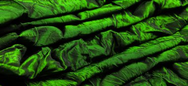 Yeşil ipek kumaş. Şu güzel yeşil ipek kumaşa bir bak. Bakması tüylü, dokunması hoş ve arka planınızla eşleştirildiğinde kumaşlar her türlü tasarım için mükemmeldir..