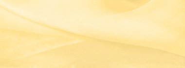 Bulanık sarı ipek kumaş. Kremsi bej rengini ve ışıldayan saten kaplamasını gösteriyor. Hala şifonun ve akıcı kumaşın tipik tazeliğini koruyor..