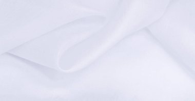 Bulanık, beyaz ipek kumaş. Organza kumaşları şeffaf ve çok hafiftir ama aynı zamanda dayanıklıdır ve berrak kumaşlarla kaplıdır. Projeleriniz gibi büyük girişimler için.