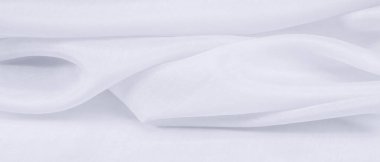 Bulanık beyaz ipek kumaş. Açık ve zarif organzalar ve saten kaplama büyük ve yapılandırılmış projeler için mükemmeldir..