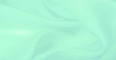 Bulanık yeşil ipek kumaş. Bu ipek ipte parlak bir cazibe çiçek açıyor. Kelly Green rengi çekici ve neşeli, ve hafif parlak yüzeyi enerjisi ve şık tonu ile uyumlu..