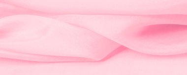 Bulanık pembe ipek kumaş. Kalabalıktan canlı bir renkle uzaklaşın. Işığı yansıtan parlak dalgalar, enfes sofistike dalgalar. Bu sıcak pembe ipek krep de chine.
