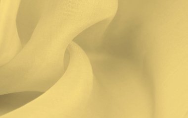 Bulanık sarı ipek kumaş. Kremsi bej rengini ve ışıldayan saten kaplamasını gösteriyor. Hala şifonun ve akıcı kumaşın tipik tazeliğini koruyor..