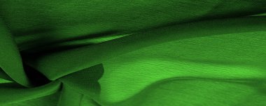Doku. Geçmişi. Geçmişi. Koyu yeşil, parlak kumaş dokusu, bu soyut bir ipek kumaş arkaplanı.