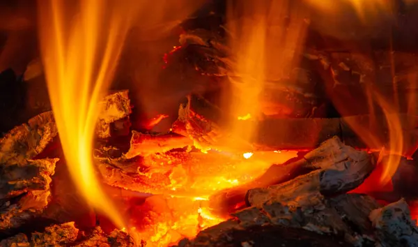 Fire in the fireplace. Aged wood smells wonderful, so if you\'re going to burn it, choose logs for the smoky, musky smell. Use kiln-dried logs to show your love for the environment.