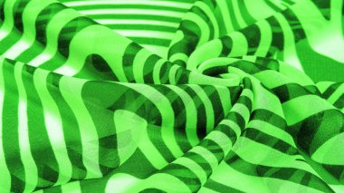İpek kumaş, yeşil ve beyaz soyut çizgiler. Soyut beyaz ve yeşil desenlerin sihirli formu. Retro modern dekor, tekstil sanatı, tasarım, doku, arkaplan, kalıp