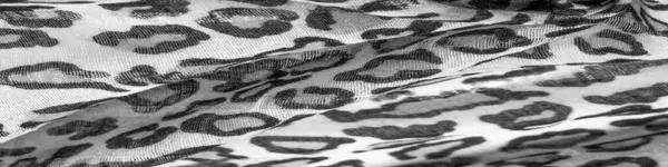 silk fabric black and white with leopard print. Lightweight silk with leopard print will perfectly match your design, looks stylish and not vulgar! Texture, background, pattern